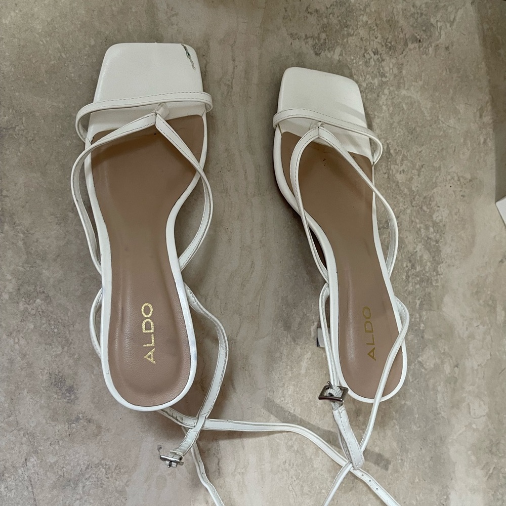 White summer sandals / heels has some scratches as you can see in the picture.